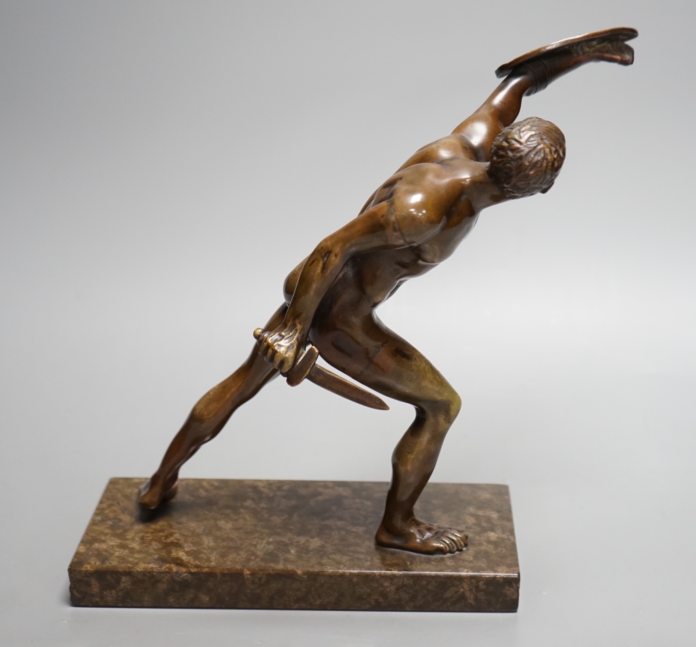 After the Antique, an early 20th century bronze study of the Borghese Gladiator, on marble base, 26cm tall